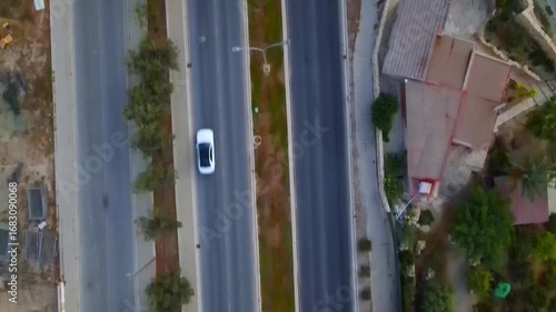 Aerial view of Larnaca, Cyprus. 
Morning traffic in the urban environment. Buildings, roads, cars and historical views.