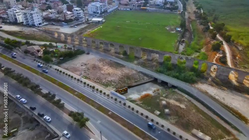Aerial view of Larnaca, Cyprus. 
Morning traffic in the urban environment. Buildings, roads, cars and historical views.
