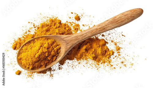 Wooden spoon full of turmeric powder, scattered on black background