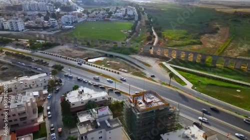 Aerial view of Larnaca, Cyprus. 
Morning traffic in the urban environment. Buildings, roads, cars and historical views.