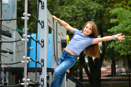 Girl playing joyfully on a playground