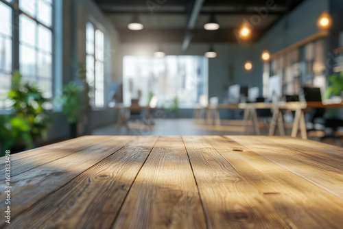 Wallpaper Mural Sunlit wooden table. Bright empty modern office. Blurred background with desks, computers, chairs, and large windows. Torontodigital.ca