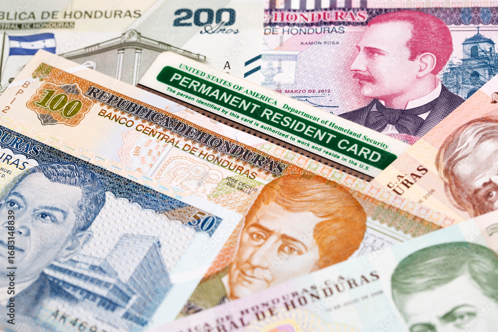 Fototapeta premium American Permanent Resident Card on Honduran Lempira