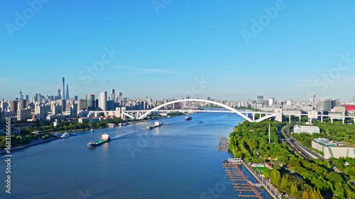 4K Real Time Aerial view of Lupu bridge and Huangpu River in Shanghai on sunny day.
