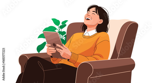 A woman is sitting on a sofa with tablet and joyfully laughing 