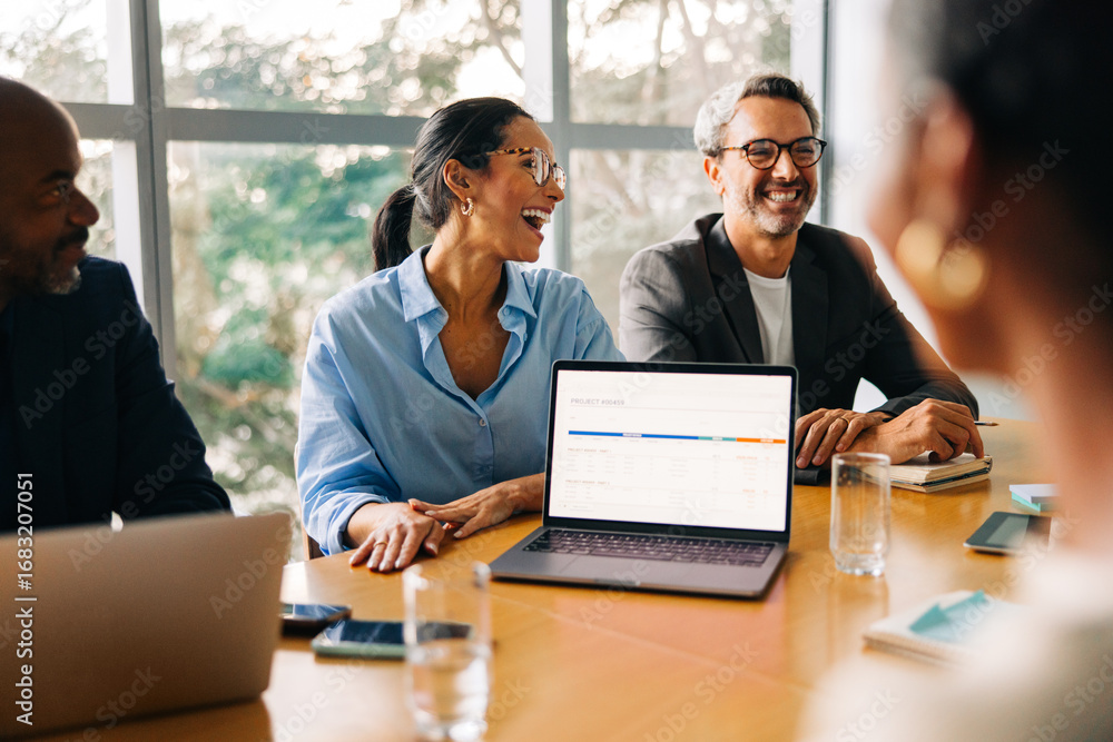 custom made wallpaper toronto digitalBusiness professionals laughing during a meeting at a conference table
