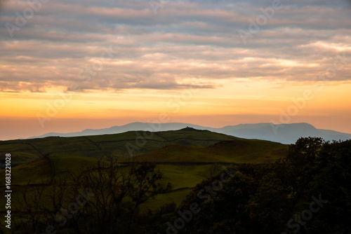 Wallpaper Mural Hilltop Cairn of rocks silhouetted by sunset evening sky, Latterbarrow, The Lake District, Cumbria, England Torontodigital.ca