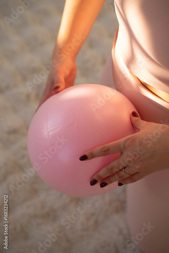 Pink exercise ball for pelvic floor training