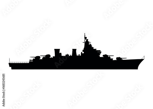 Silhouette of a cargo ship near city skyline over the ocean