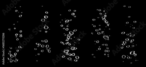 Fotografie Clear water bubbles rising underwater on black background, abstract texture symb