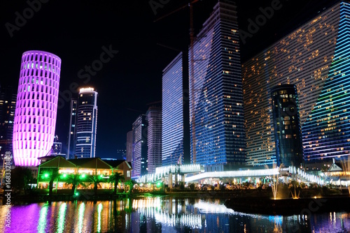 Wallpaper Mural Night view of tall buildings with lighting and reflection in the water. Georgia, Batumi. Torontodigital.ca