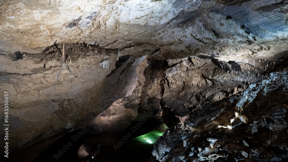 Fototapeta premium Demanovska Cave Of Liberty In Low Tatras Slovakia With Stalactites Stalagmites And Underground Waterfall Lake Most Visited Cave In Slovakia Natural Limestone Formations