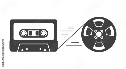 Retro audio cassette tape connected to a reel to reel player for vintage sound capture and playback
