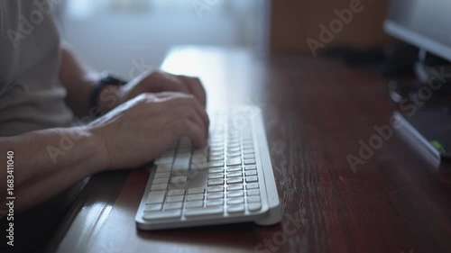 Man typing on wireless keyboard