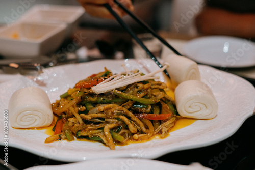 Chili Pork Stir-fry with Steamed Buns at a Korean-Chinese Restaurant
