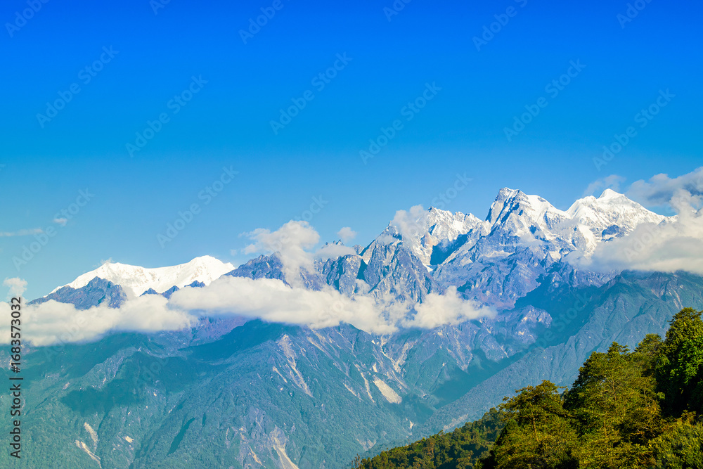 Fototapeta premium Beautiful view of Himalayan mountains at Ravangla, Sikkim. Himalaya is the great mountain range in Asia with more than 50 peaks , mostly highest, including mount Everest the highest in the world.
