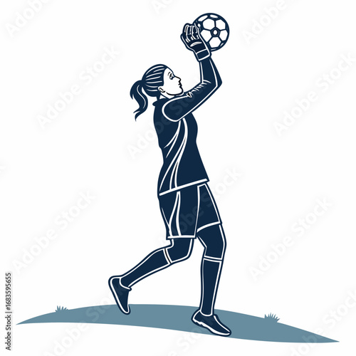 Female soccer goalkeeper catching ball in mid-air football