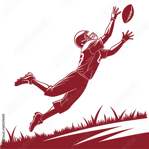 Football player diving to catch a football with grass