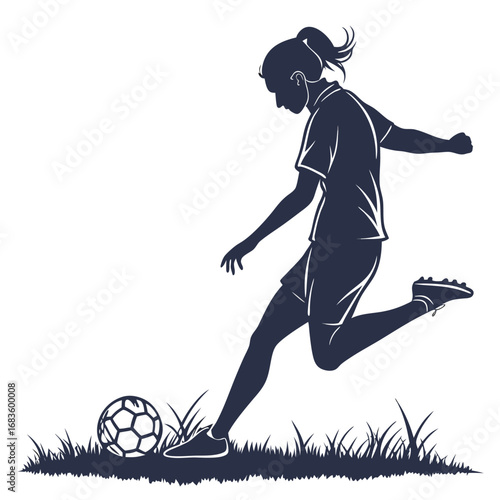 Woman soccer player kicking ball in grass silhouette