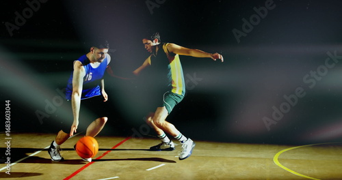 Fotografi Dribbling basketball blue jersey 16 navigating around defender at gym court line
