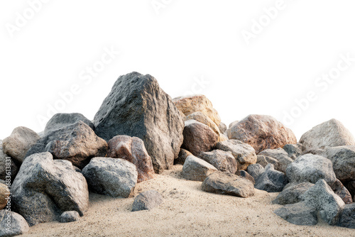 A pile of rocks on sand.  Close-up, horizontal