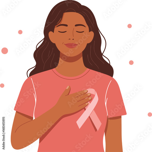 Woman with hand on chest wearing pink ribbon for breast cancer awareness