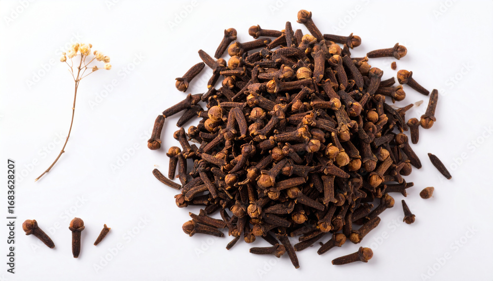 Obraz premium Aromatic pile of whole dried clove spice buds, a popular culinary ingredient for cooking and seasoning, isolated on a white background