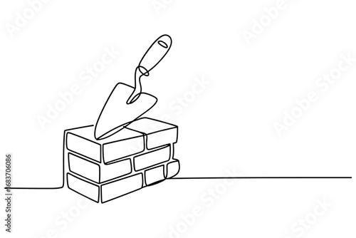 Trowel resting on a stack of bricks in a simple line drawing