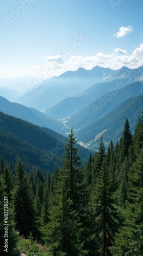 Serene Alpine Valley Vista with Layered Blue Mountains and Lush Pine Forests under Clear Sky