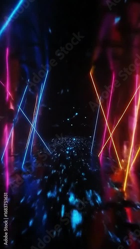 Neon lights and glitter particles moving in a dark space
