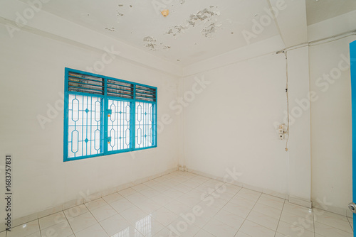 Photography Empty Room with Teal Window and Damaged Ceiling