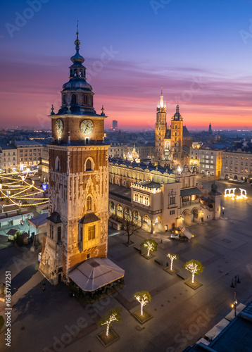 Town Hall Tower and St Marys Church over Main Square in Krakow, Poland, colorful sunrise