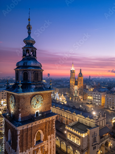 Town Hall Tower and St Marys Church over Main Square in Krakow, Poland, colorful sunrise