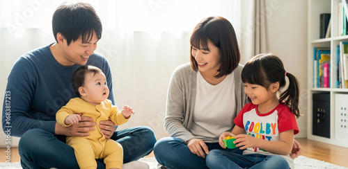 Young Asian family sitting on the floor