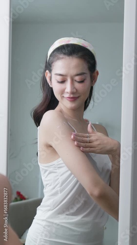 Beautiful woman applying skin lotion, beauty and skincare concept.