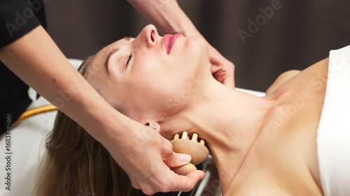 Young woman receiving a relaxing facial massage in a serene spa environment, with soothing lighting and natural elements enhancing the rejuvenating experience of facial care and wellness