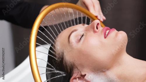 Woman receiving hydromassage treatment in a serene spa environment, enjoying aqua massage therapy with soothing water jets, promoting relaxation and rejuvenation for overall wellness experience