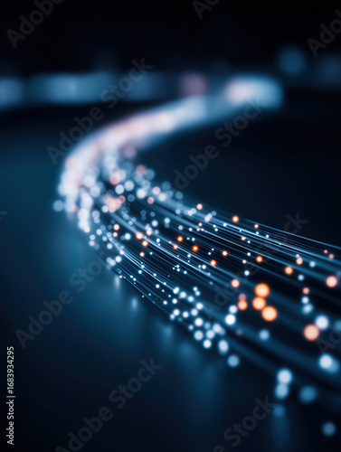 Illuminated fiber optic cables transmit glowing data through advanced digital network.