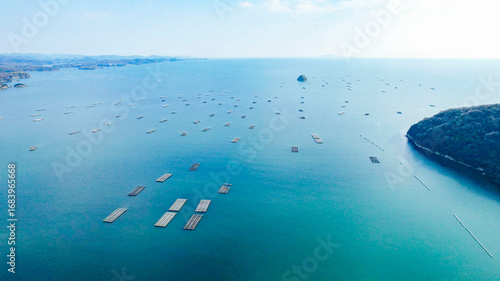 Photos ドローン空撮による冬の瀬戸内海の牡蠣漁風景多島美（岡山県）/Oyster rafts in Seto Inland Sea, Okayama, Japan