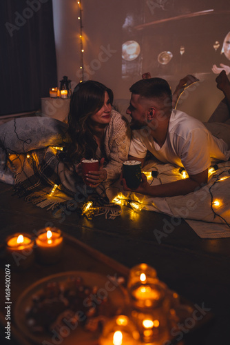 Canvas Print Cozy romantic evening, home weekend In bed for a loving couple