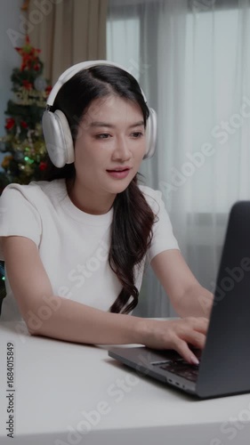 Asian young business woman working on laptop at home office.