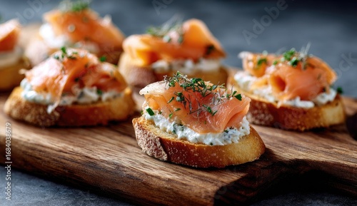Toasted baguette slices topped with smoked salmon and cream cheese, garnished with fresh herbs
