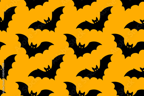 Seamless pattern with flying black bats on orange background. Perfect for Halloween spooky designs