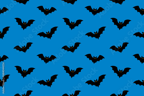 Seamless pattern with flying black bats on blue background. Halloween spooky vector illustration