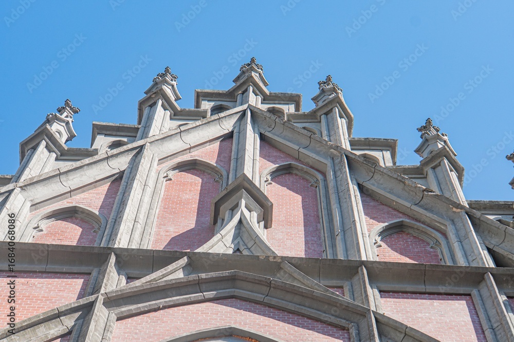 Obraz premium Old Roman Catholic church, Gothic architecture, arches, columns, earth tones, stone texture, natural lighting, overcast sky or sun low angle, monumental quality