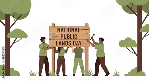 Diverse group erecting a National Public Lands Day sign in a forest.