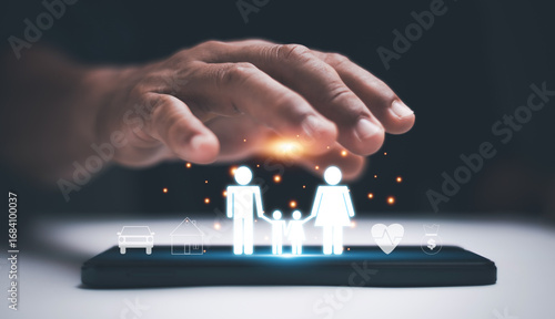 Family insurance protection concept with digital icons of parents, child, health, home, car and finance on smartphone. Symbol of safety, care, security and future financial planning.