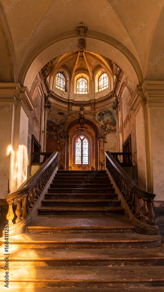 Fototapeta premium Sunlit, old, grand staircase