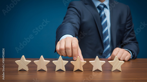 Business professional selects wooden star for customer service rating on table