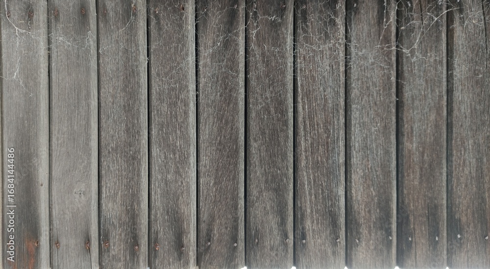 Fototapeta premium Old wooden plank wall with rustic texture and natural grain. Perfect for backgrounds, design templates, product mockups, and creative projects. Ideal for graphic designers, architects, decorators, and